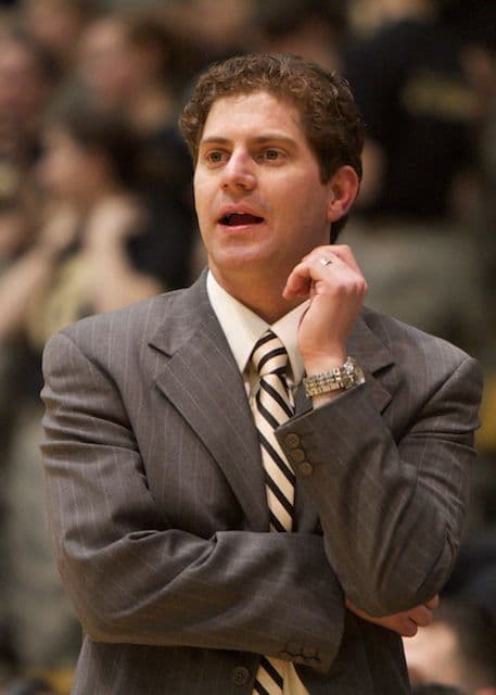 Zach Spiker in a suit on the sideline, coaching Army against Navy.